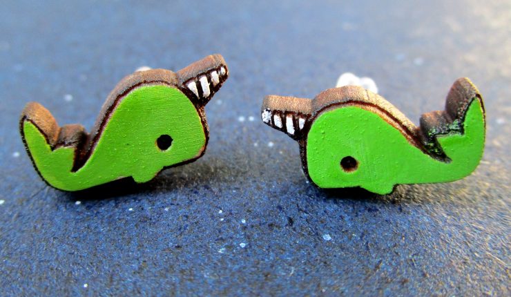 2 green narwhal stud earrings close up